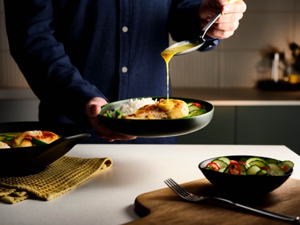 Malaysian turmeric chicken with pickled cucumber salad and rice.