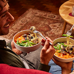 Friends sharing a meal at a table