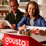 Couple opening a meal kit box