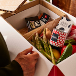 Opened meal kit box showing fresh ingredients