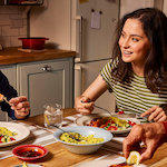 Family sharing a meal together at the dinner table