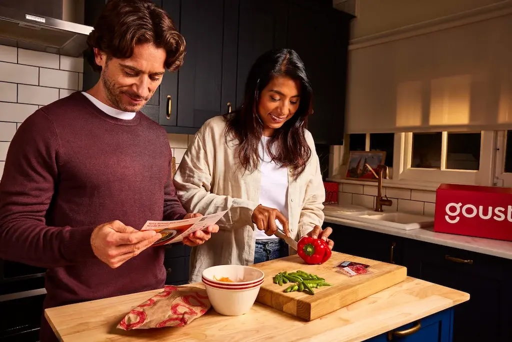 Couple cooking a Spicy Sichuan-style Veggie Noodle Bowl Gousto recipe