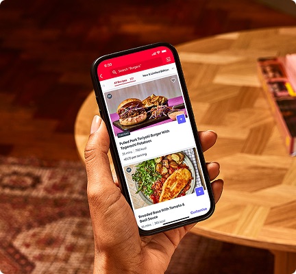 Step 2: Person scrolling the Gousto weekly menu to pick recipes for their meal kit.